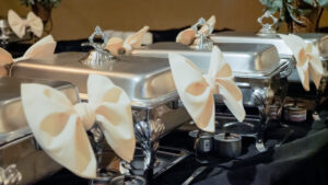 Catering dishes set up with with bows